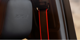 Close-up of the Display Dashboard with the Driver Selecting a Program in a 2026 Chevy Colorado