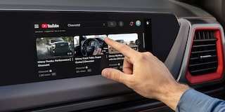 Close-up of the Display Dashboard with the Driver Selecting a Program in a 2026 Chevy Colorado