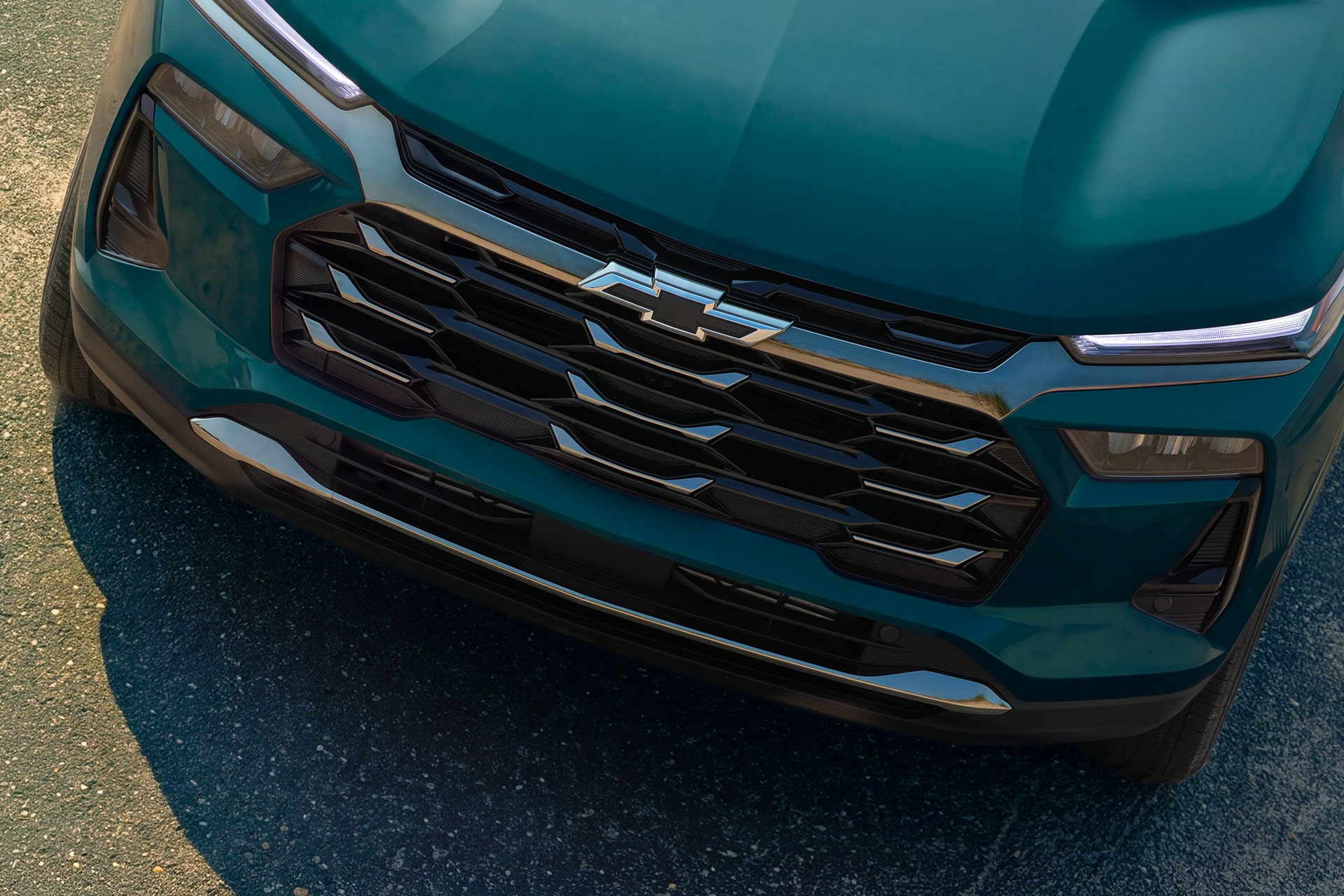 A Close-Up of the Front Grille and Chevy Emblem on a Chevy Trax.