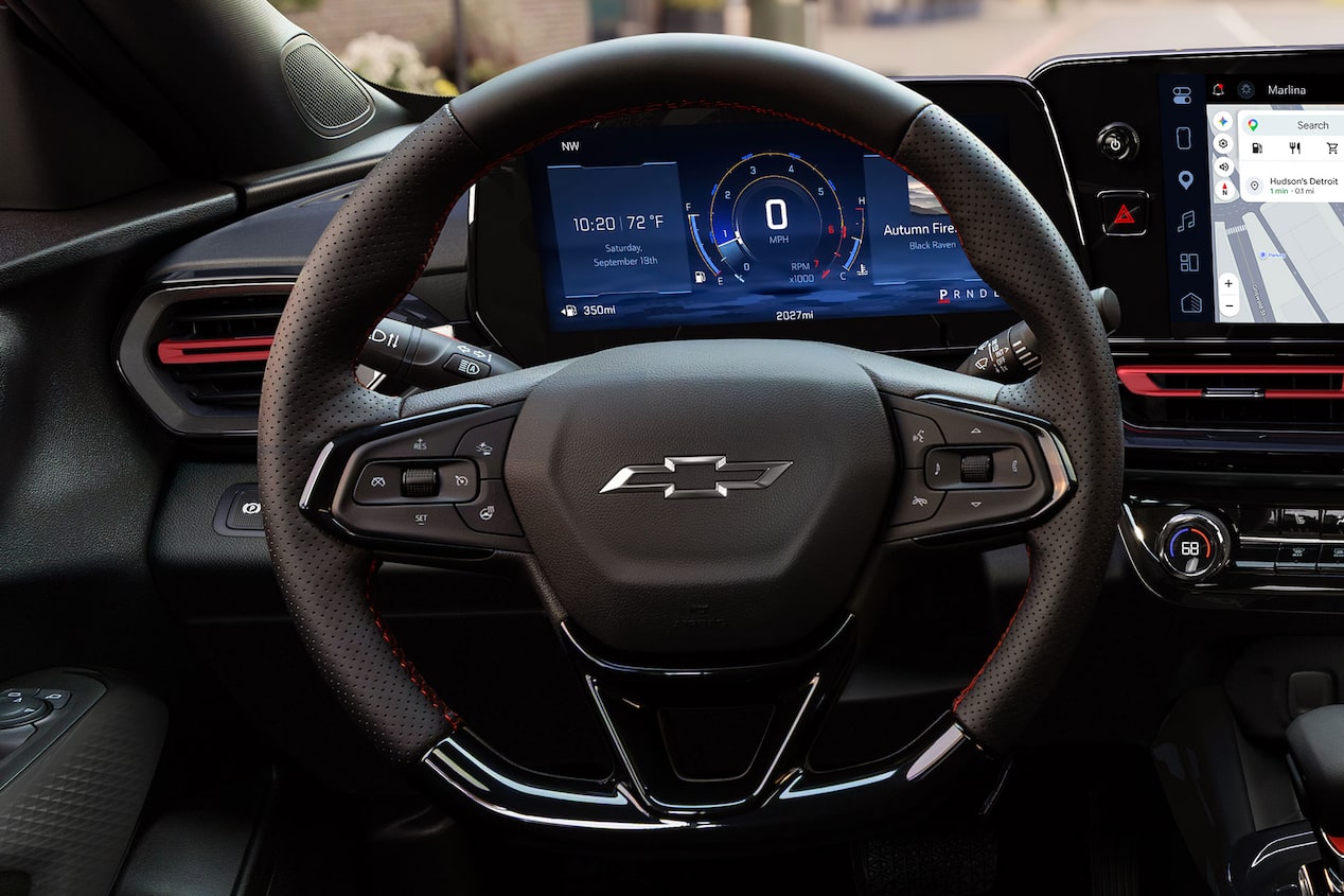 A Close-Up of the Chevy Trax Steering Wheel Positioned in Front of the Digital Driver Information Center and Infotainment Display.