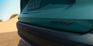 A Close-Up View of the ACTIV Badge on the Rear Liftgate of a Blue-Green Chevy Trax.