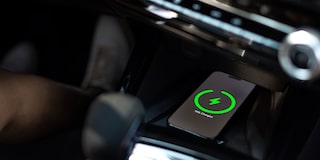 A Smartphone Charging Wirelessly on the Center Console of a Chevy Trax.