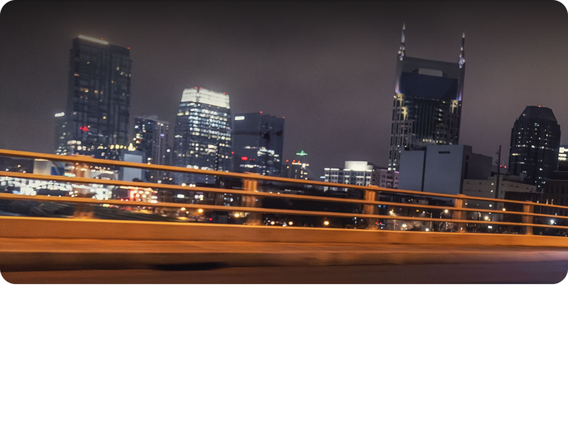 A View of a City Skyline Captured at Night.