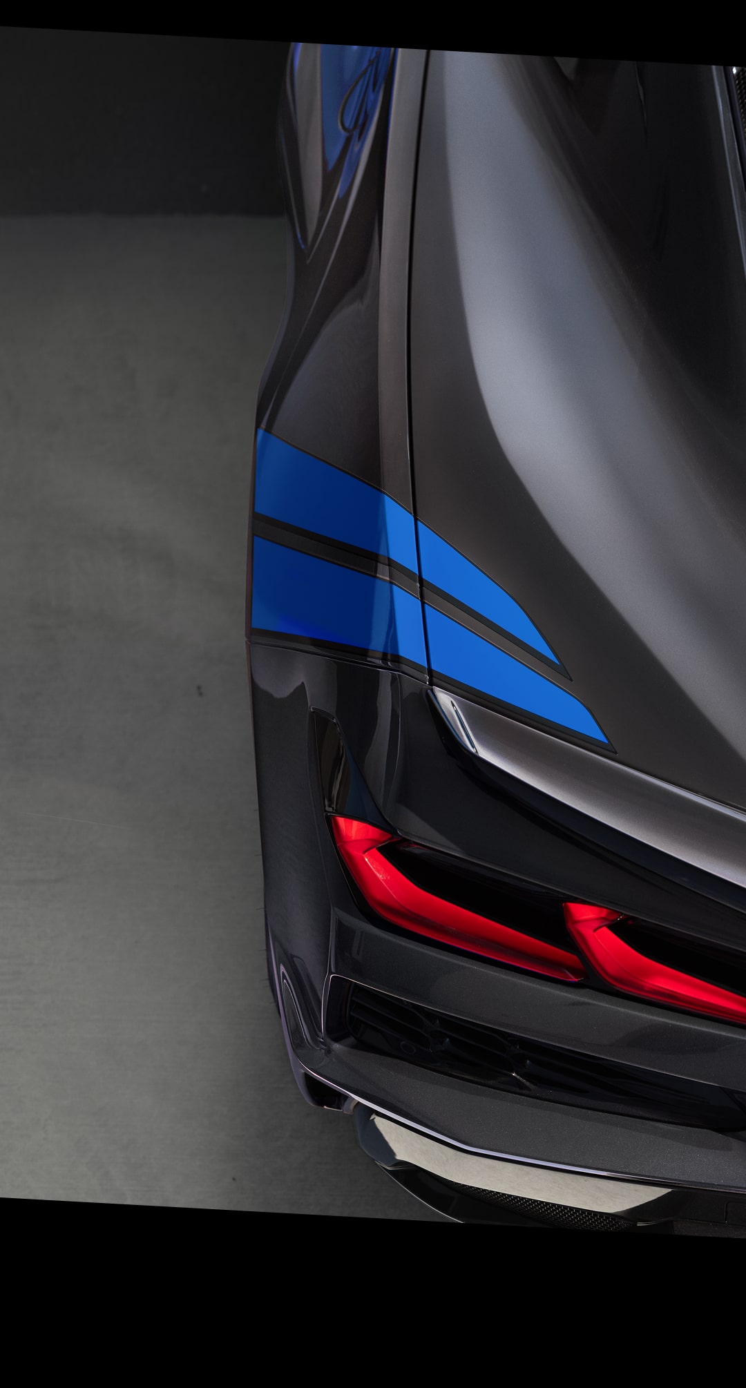Close‑Up View of the Grand Sport X Rear Exterior Lights and Blue Accent Stripes