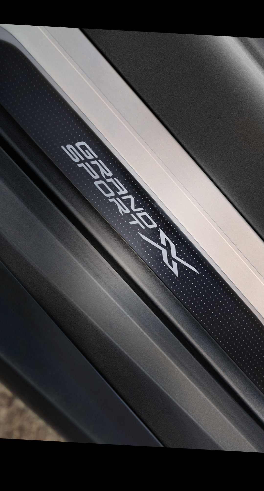 Close-up of the Grand Sport X Emblem on the Door Interior of the Corvette
