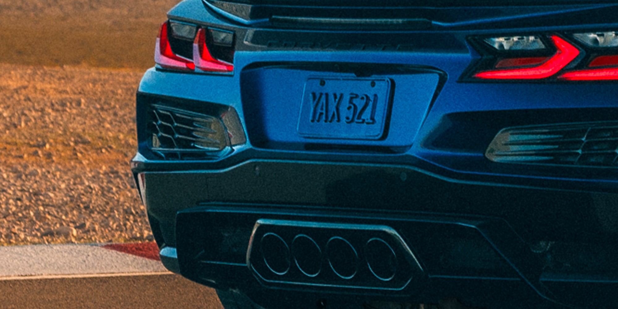 Close-up of the 2027 Corvette Grand Sport Rear End with its Brake Lights On
