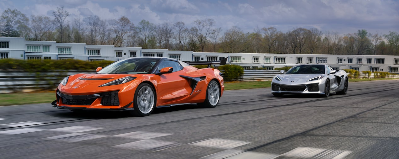 The MY26 ZR1X 3LZ Convertible in Sebring Orange Tintcoat and the MY26 ZR1X 3LZ Coupe in Blade Silver On the Track