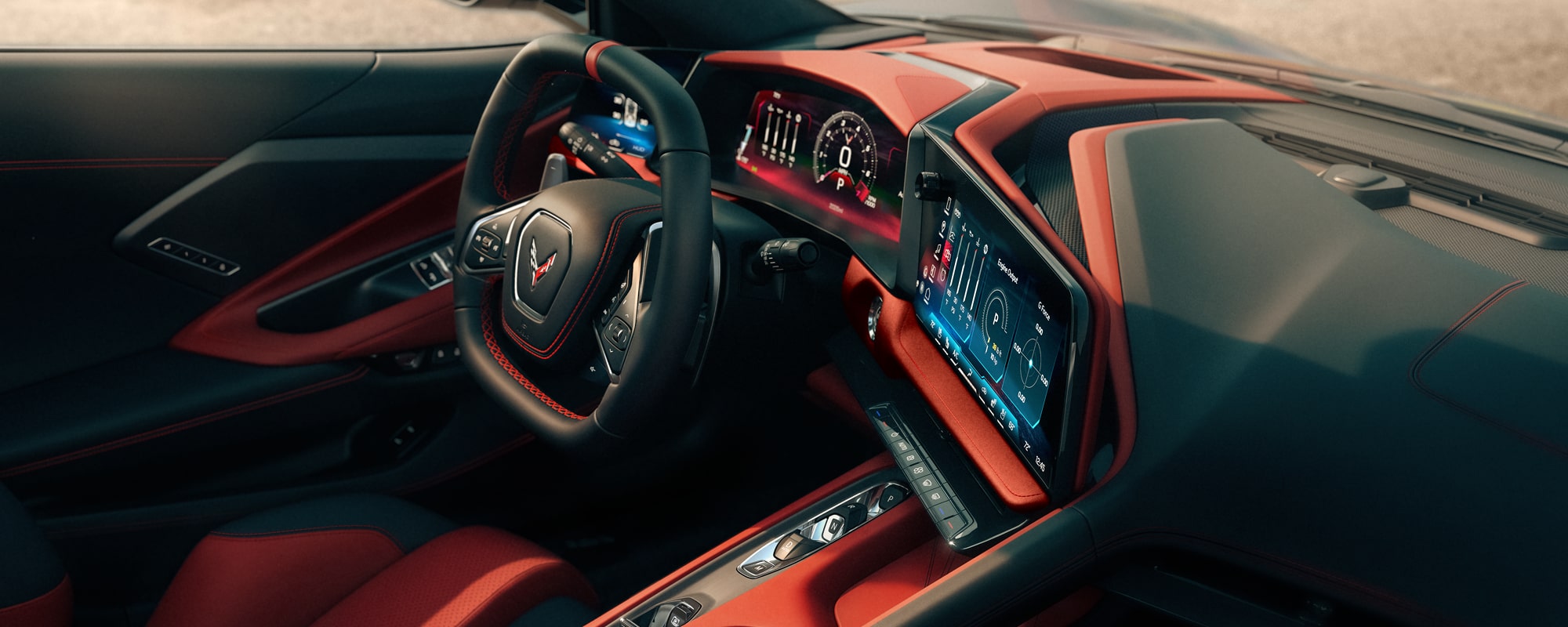 The Red Interior of a Chevrolet Corvette Grand Sport Features a Driver‑Focused Cockpit With a Digital Gauge Cluster, Central Touchscreen, and Dashboard Design.