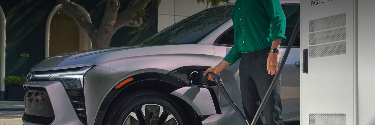 Person Plugging in Their Blazer EV to a Charger