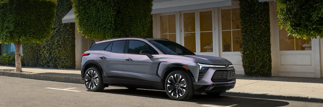 Grey Blazer EV Parked on City Street