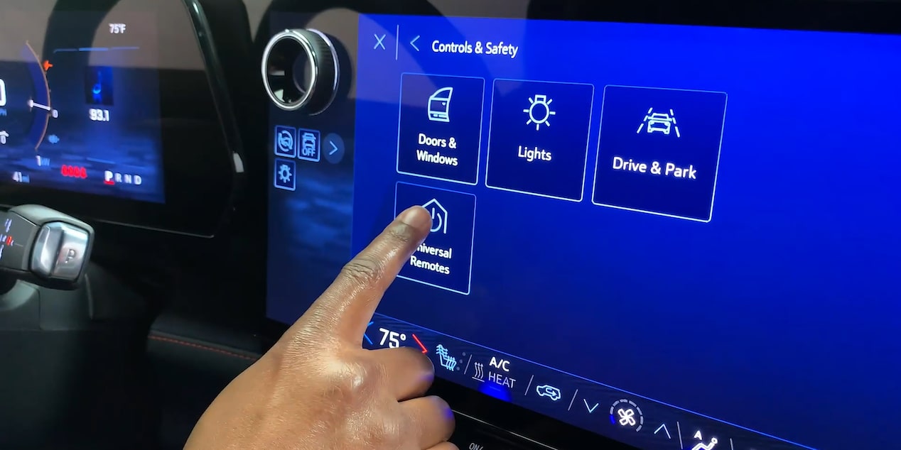 Person Interacting with Blazer EV Display Screen to Program Garage Door