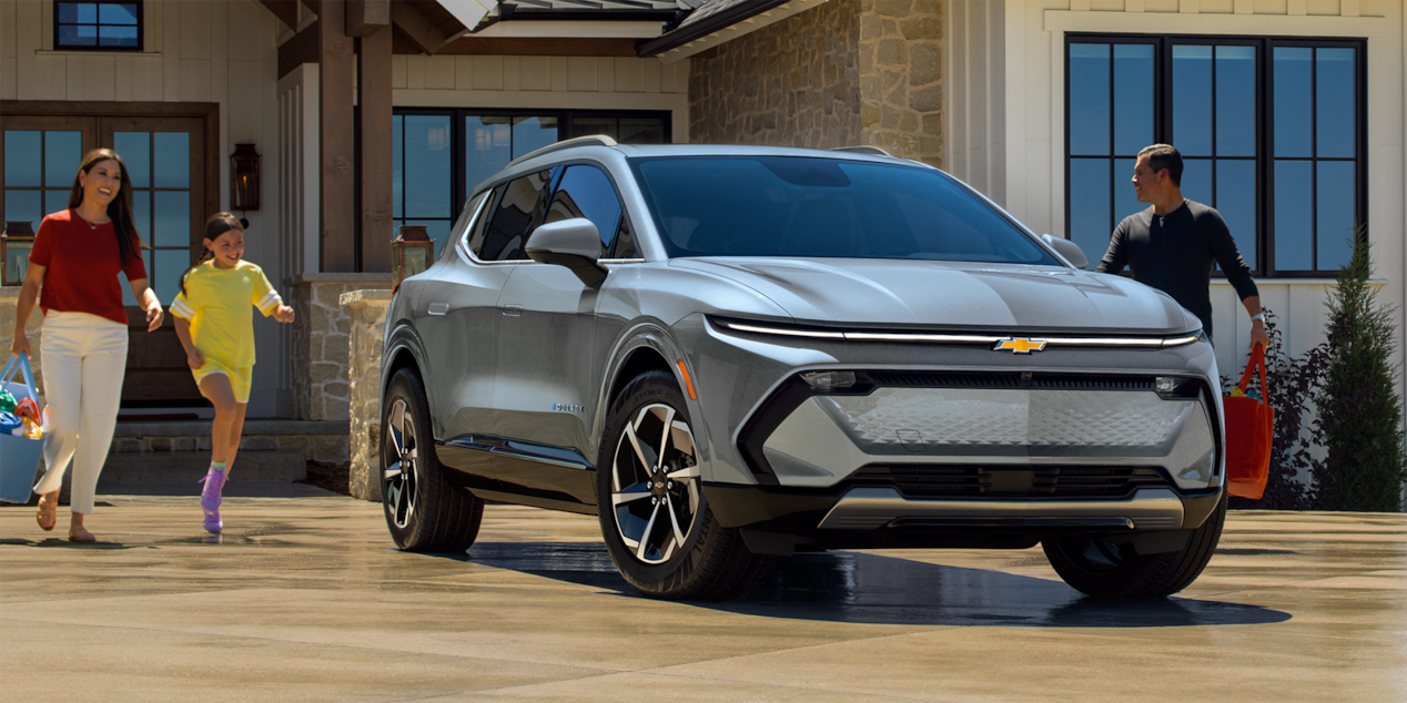 Front View of Equinox EV Driving on Road in City