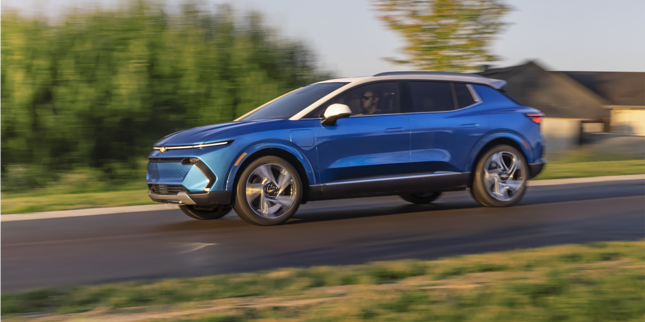 2024 Chevy Equinox EV Driving Down a Residental Road