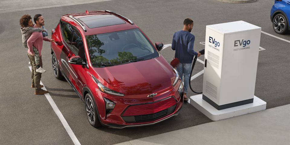 A Family Charging their Chevy Bolt EUV at a Public Charging Station