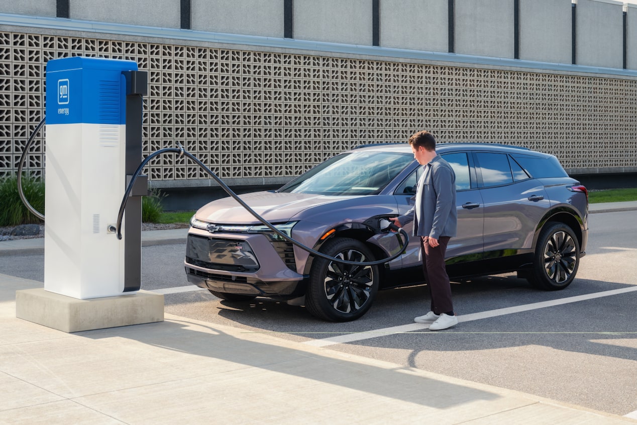 Man Charging his Chevy Blazer EV at a Public Charging Station