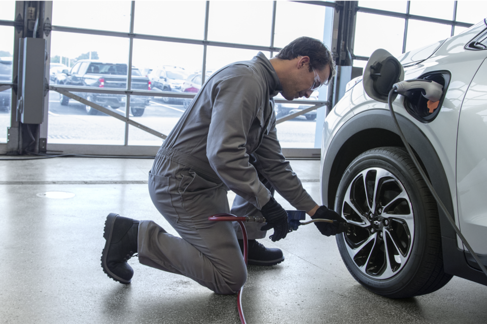 EV Mechanic Repairing a Chevy EV