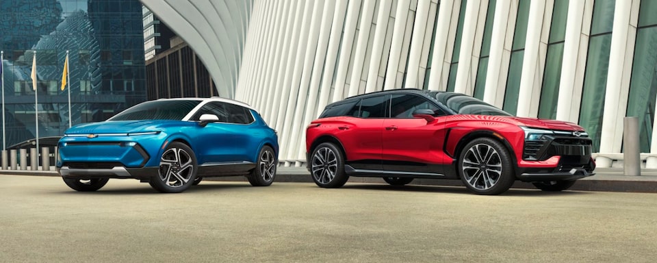 Blue Equinox EV and Red Blazer EV Parked