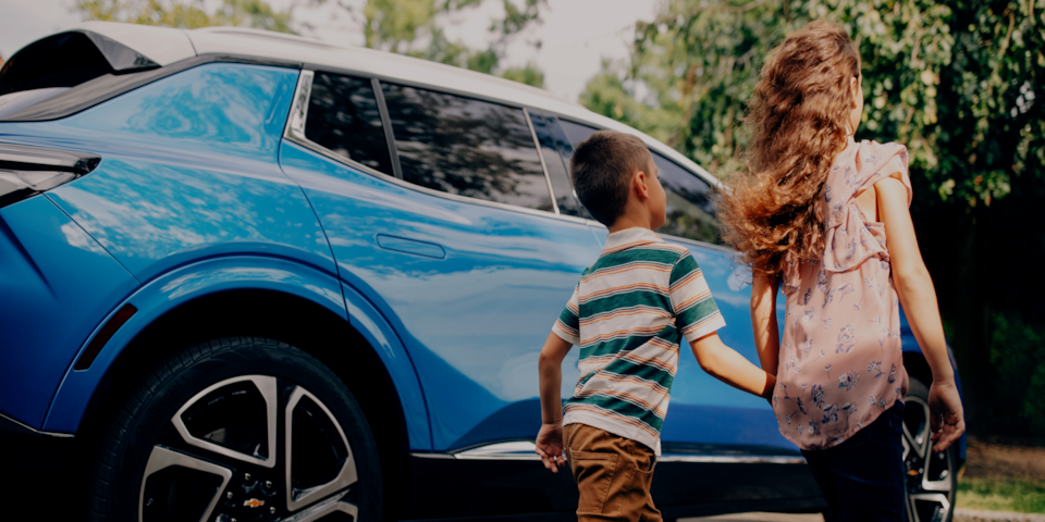 Chevy Equinox with children holding hands