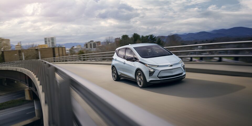 Bolt EV Driving on Overpass Near City
