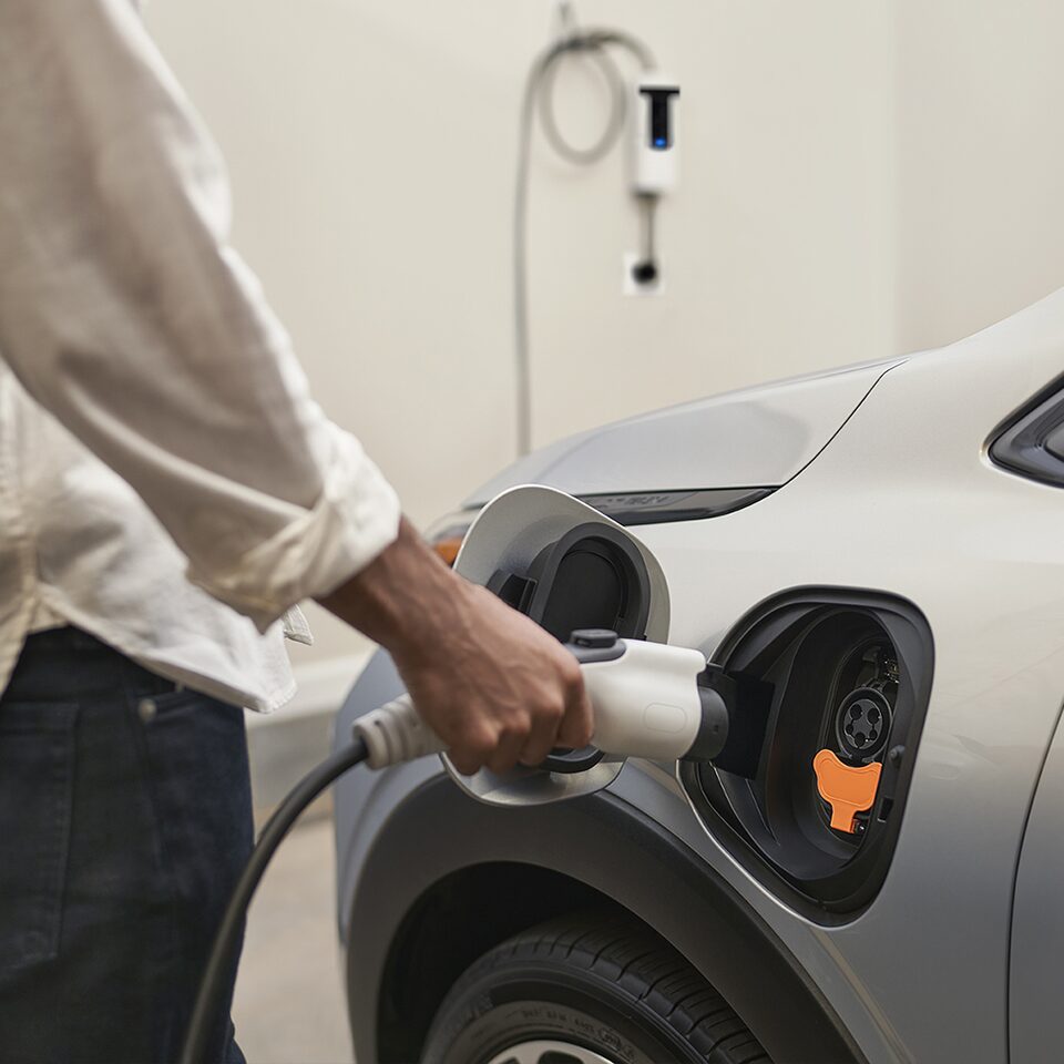 A Chevrolet Electric Vehicle Owner Charging Their Car