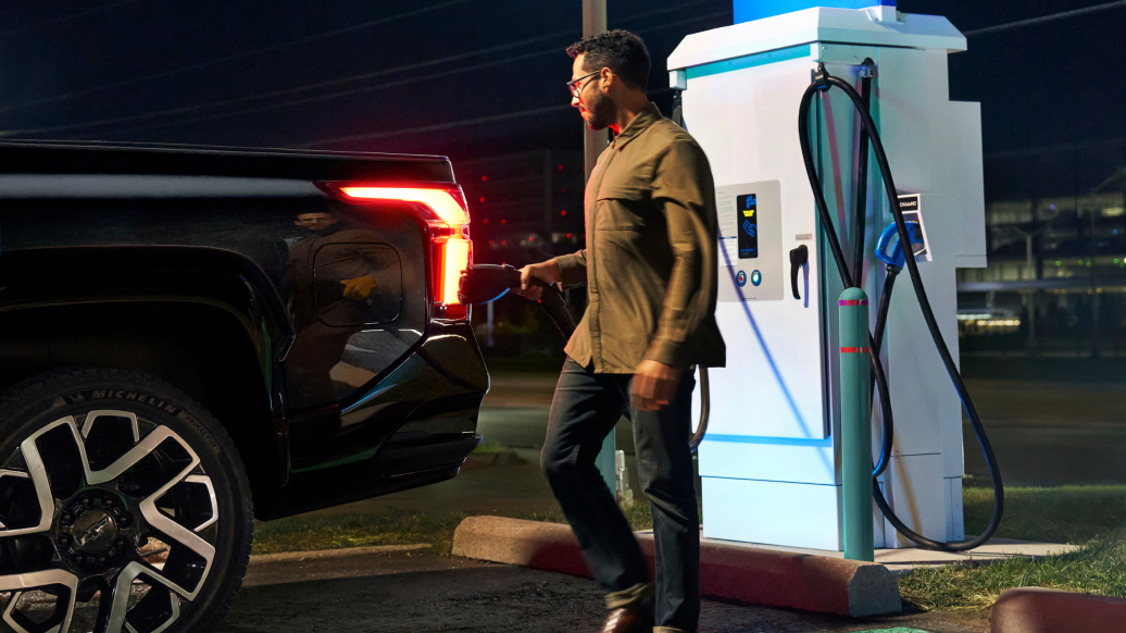 Person Charging Silverado EV at Night