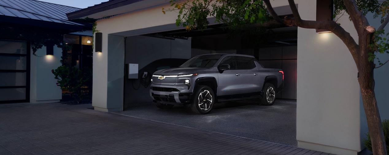 Silverado EV Parked in Garage of Modern Home