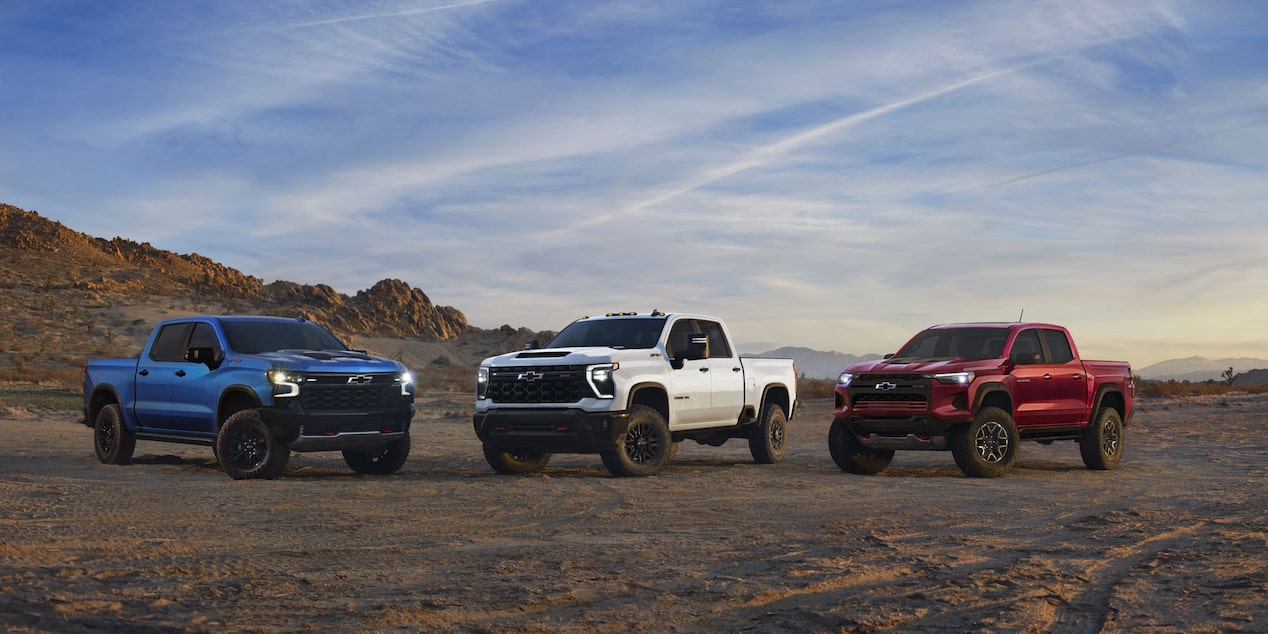 Chevy Off-Roading Truck Lineup Parked on a Desert Terrain