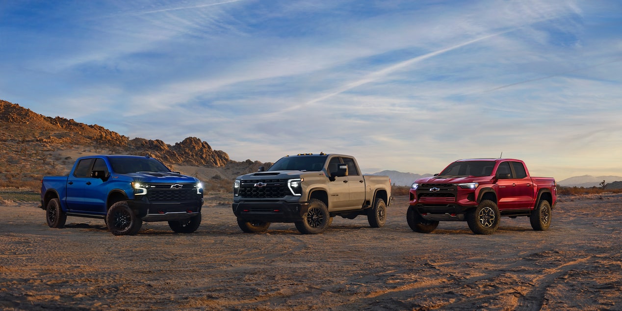 Chevy Off-Roading Truck Lineup Parked on a Desert Terrain