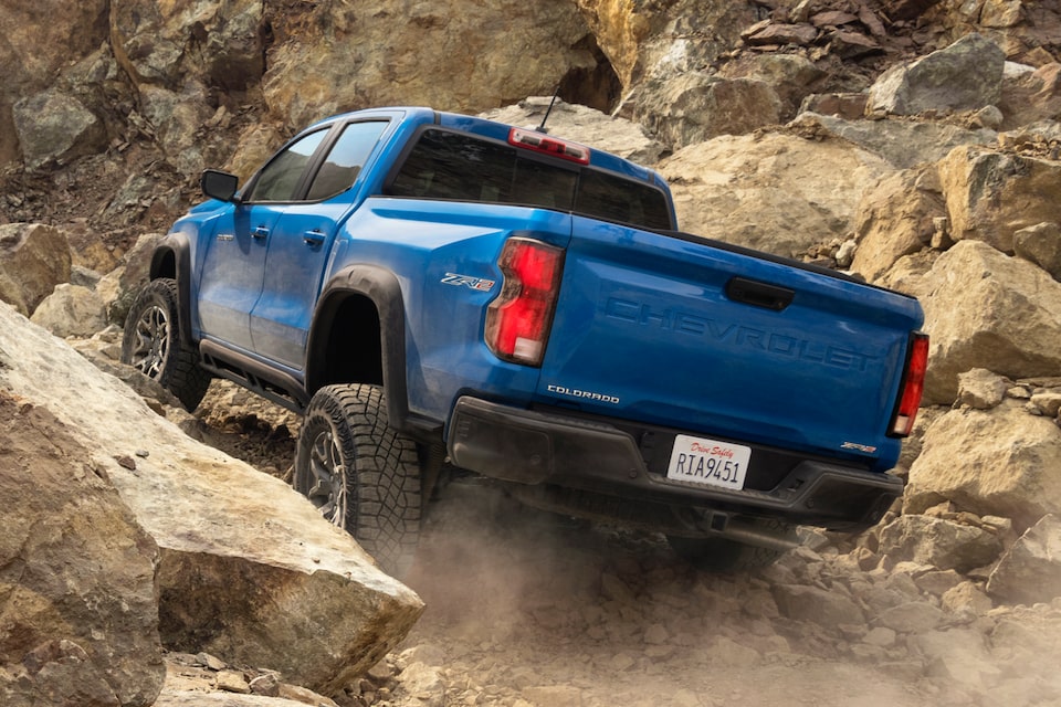 Blue Colorado ZR2 Driving on Rocky Off-Road Terrain