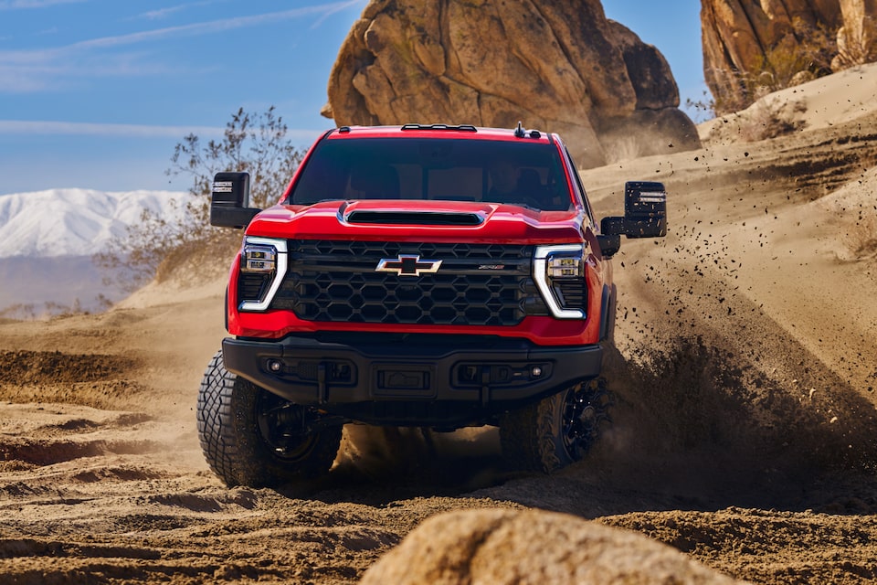 Red ZR2 Truck Offroading in Desert