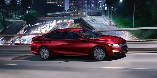 Sport Edition Chevy Malibu Speeding Over a Bridge