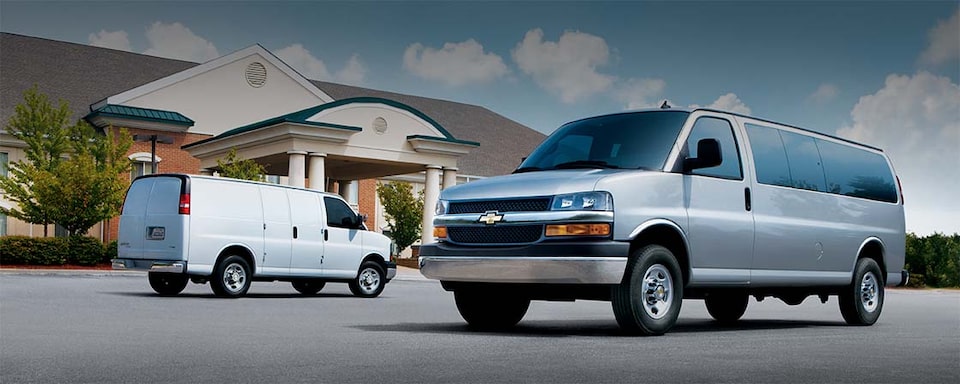 2023 Chevy Express Cargo & Passenger Van Fleet Outside City Hall