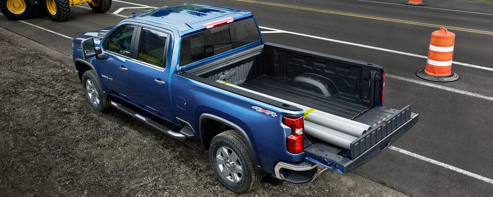 Commercial Chevy Silverado HD Parked in a Construction Site While Using the Multiflex Tailgate