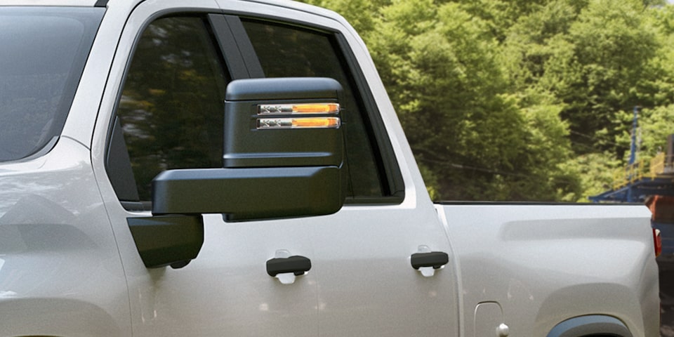 Advanced Side Mirrors on an all White Commercial Chevy Silverado HD