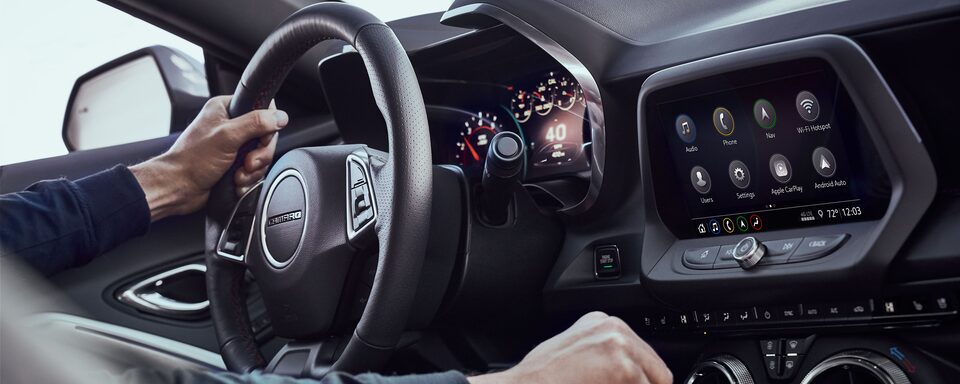 Camaro driver shifts gears inside of the new Camaro