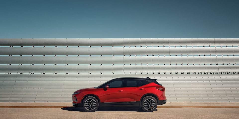 The 2023 Radiant Red Tintcoat Chevy Blazer Accenting its Surroundings