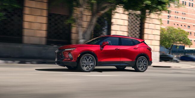 The Chevrolet Blazer Cruises Through City Landscape During the Day