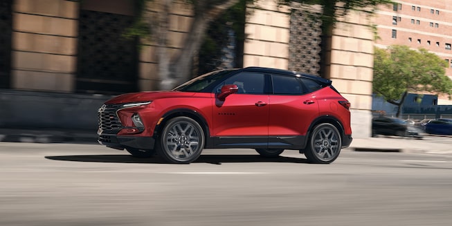 The Chevrolet Blazer Cruises Through City Landscape During the Day