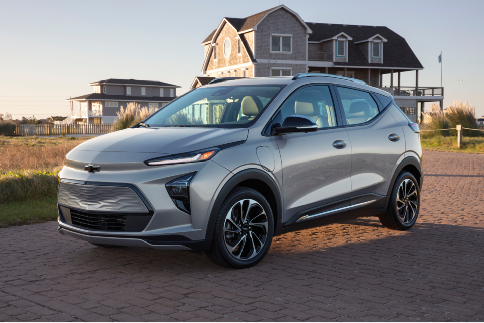 Silver 2023 Bolt EUV Parked in Driveway of Home