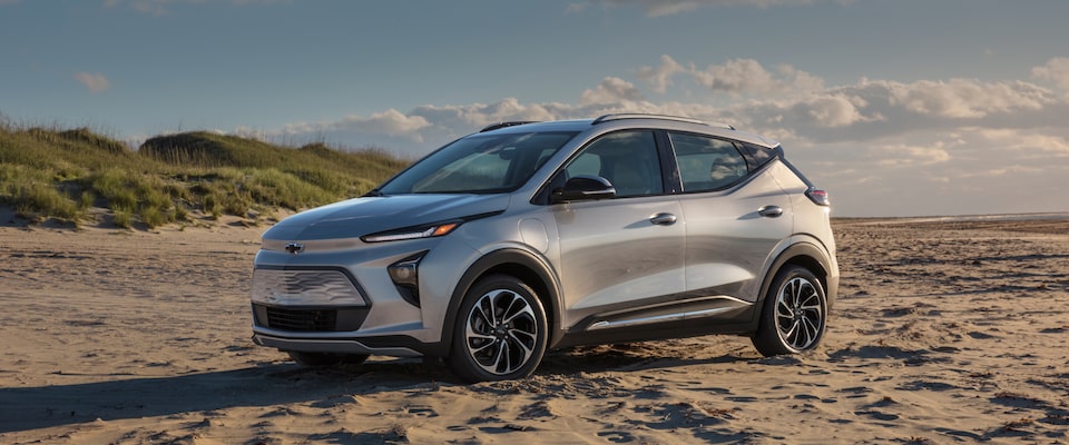 Front 3/4 Shot of Silver 2023 Bolt EUV Parked Proudly on Sandy Beach