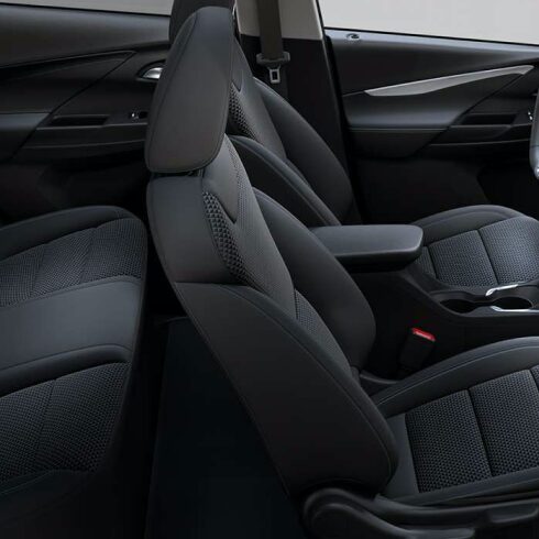 2023 Bolt EV Driver Holding Steering Wheel Next to Infotainment Screen