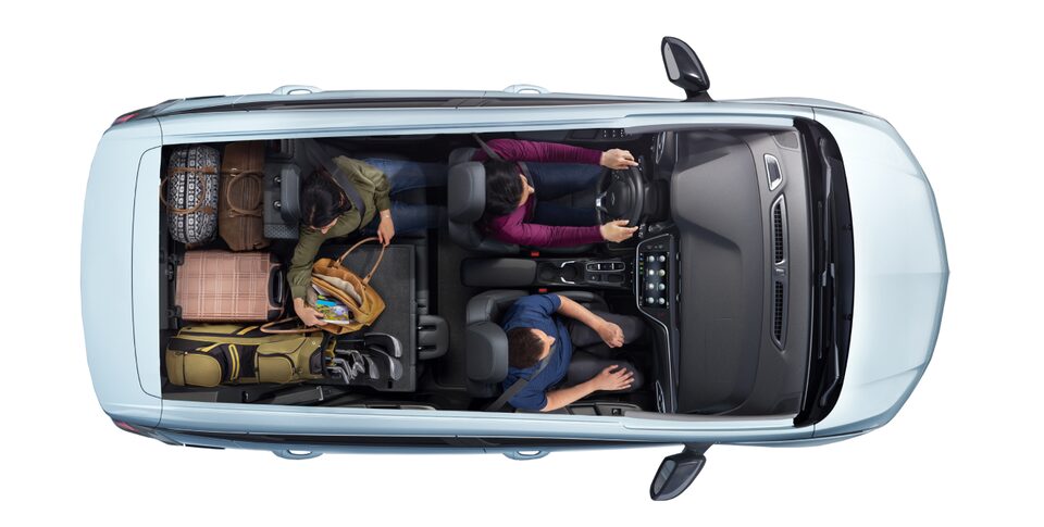Overhead Cargo Image Showing 2023 Bolt EV With 3 Passengers and Plenty of Cargo