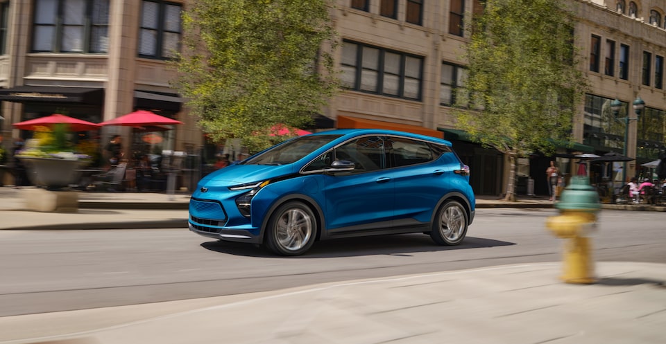 2023 Bolt EV Driving Down Urban Street