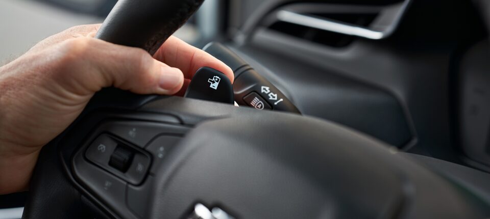 Driver's Hand on Regen on Demand Button of 2023 Bolt EV 