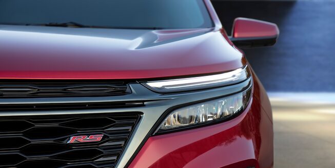 The 2023 Cherry Red Tintcoat Chevy Equinox LED Headlamps