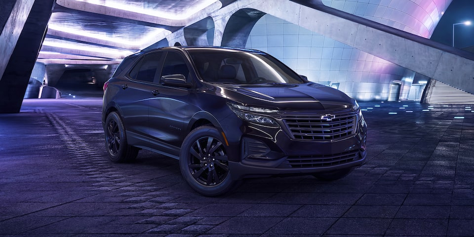 The 2023 Equinox Midnight Edition Parked in a structure at night