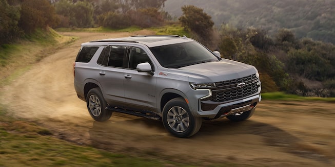 The Summit White Tahoe Taking on A Steep Decline with Ease