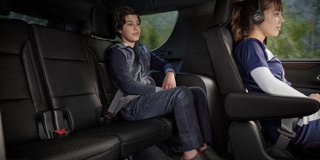 Two Children Enjoy the Comfortable Seats of Their Chevy Tahoe