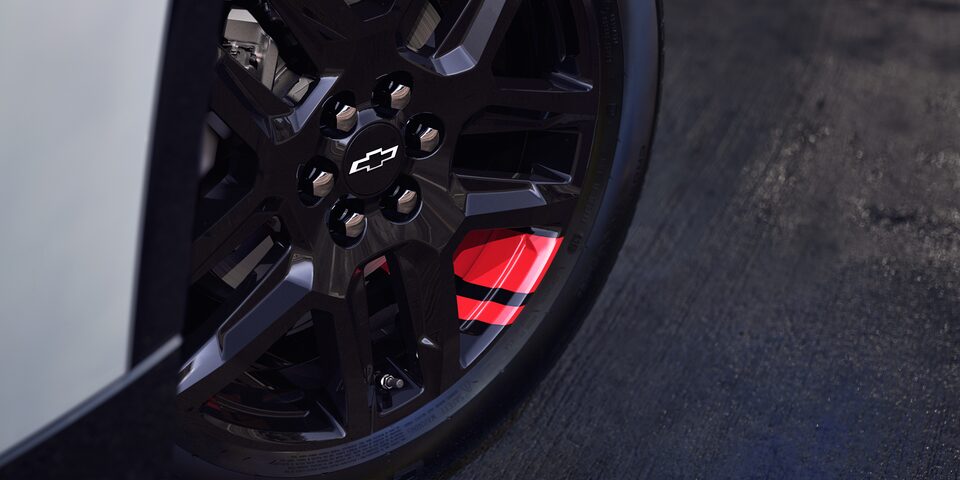 2023 Chevrolet Traverse Mid Side SUV Exterior in Redline Edition Trim Close-Up View of Rims