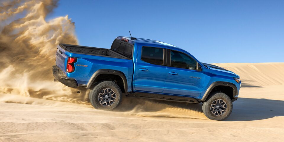 The 2023 Bright Blue Metallic Chevy Colorado Demonstrates Off-Road Superiority in Sand Dunes